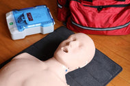 First Aid dummy, medical bag, and AED trainer