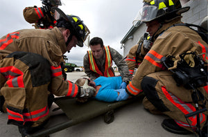Fire fighters and first responders, first aid with patient