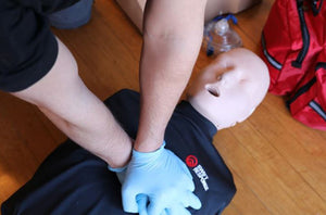 CPR being performed on a First Aid Dummy