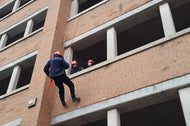 Rescuer rappelling during rope rescue training course